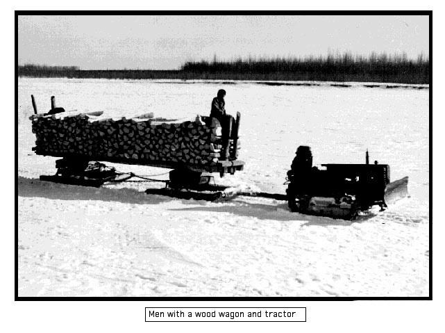 David Collin with a sled full of chopped wood