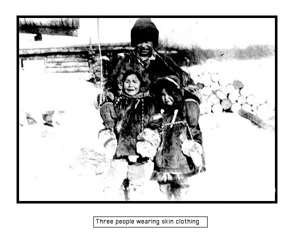 Picture of Titus Peter with two young girls dressed in traditional winter clothes