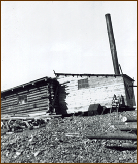 Picture of two buildings in a mining camp