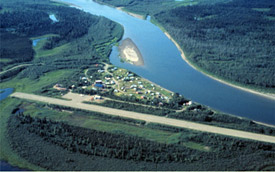 Aerial view of Kobuk, the airstrip, and the Kobuk River in the summer. Courtesy of the National Park Service.