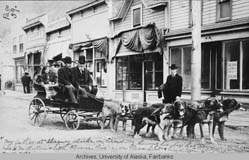 cart being pulled by dogteam on Broadway street in Skagway