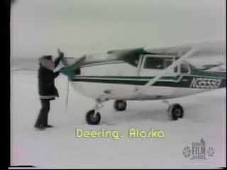 Hand-propping a Cessna 206 at Deering 