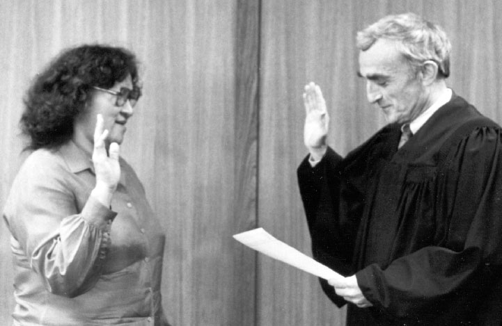 Photo of native woman being sworn in by judge