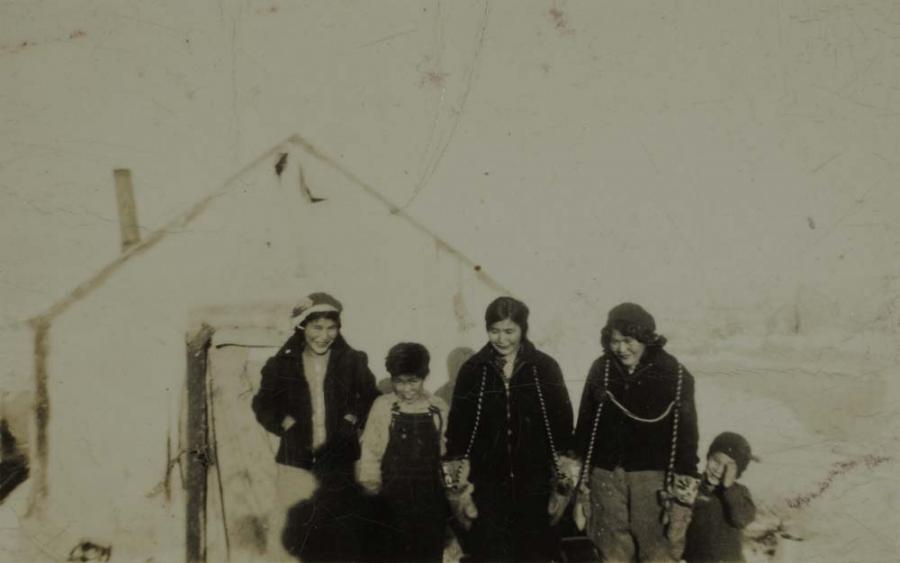 People in Front of Wall Tent
