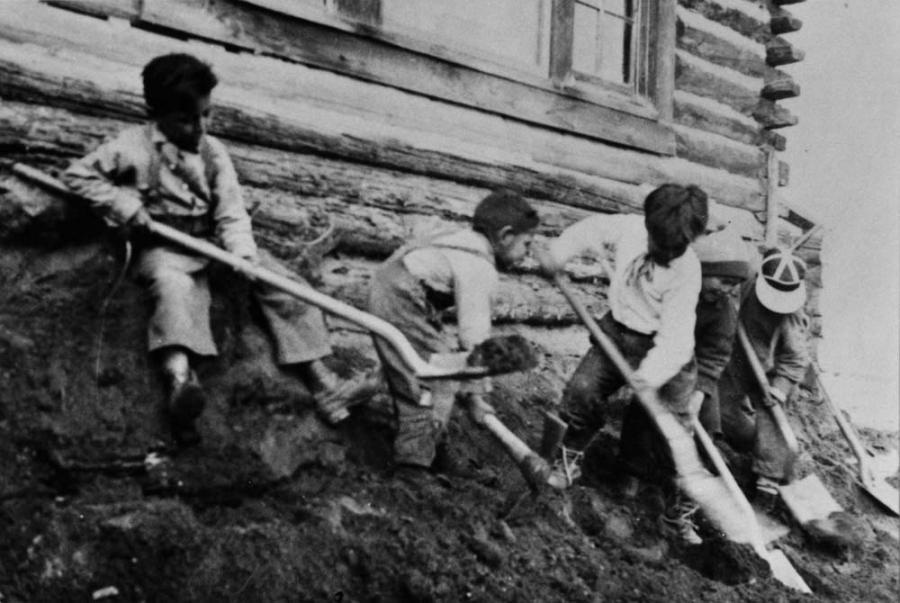 Boys Digging With Shovels